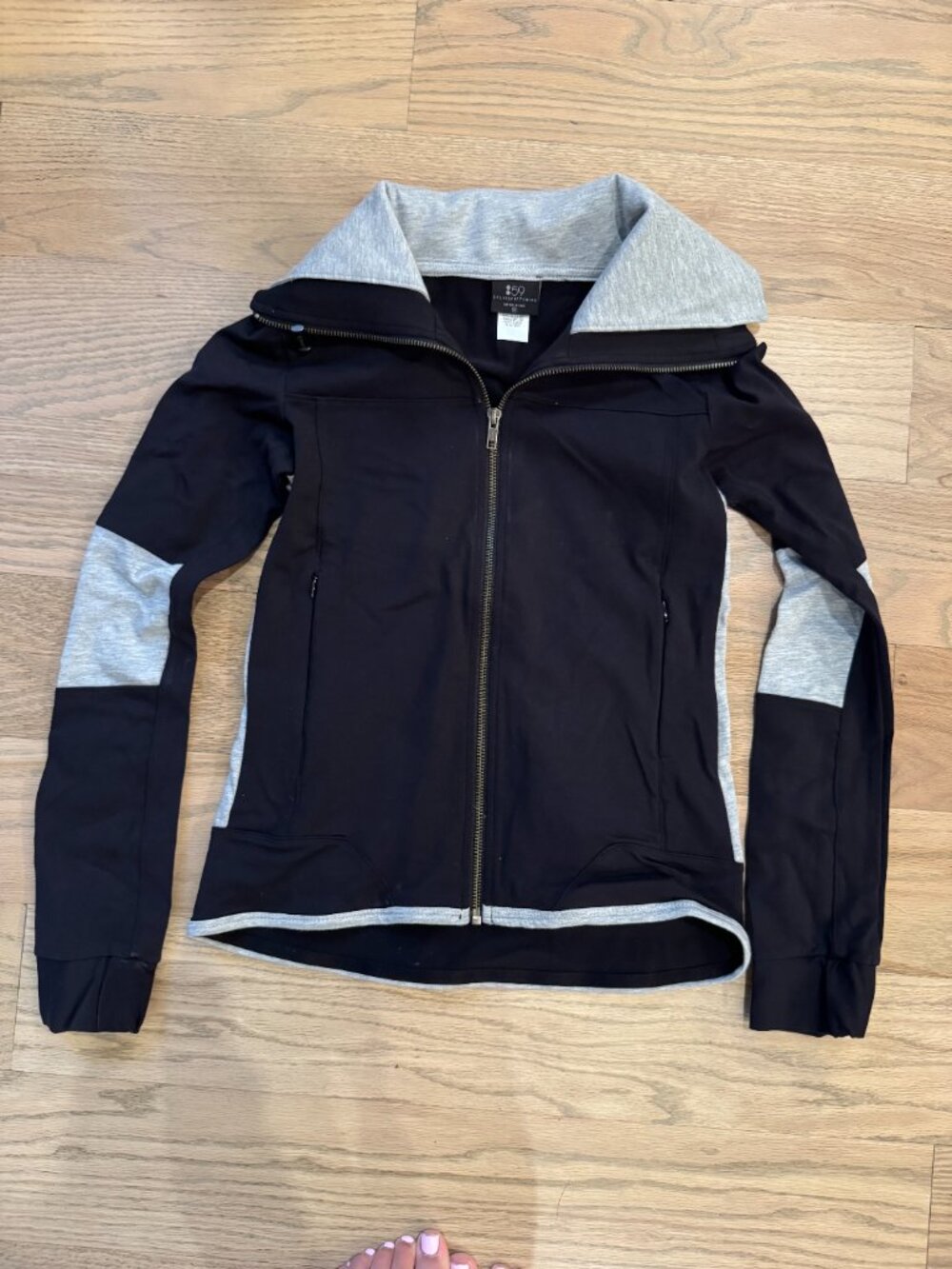 Black zip up with grey accents. Size XS